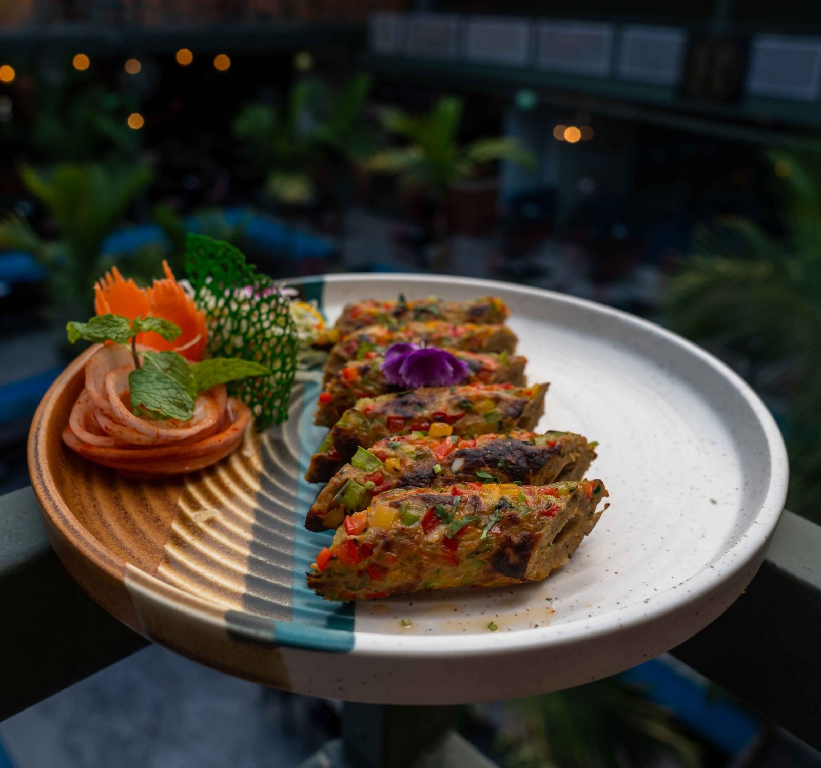 A beautifully plated dish of vegetable kebabs with artistic garnish, perfect for culinary presentations.