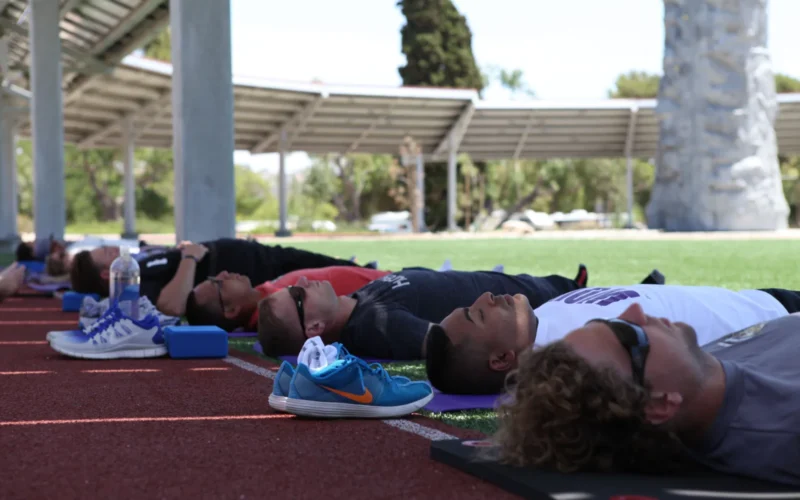 Swimmers participate in the yoga portion of training in order to develop proper breathing techniques and aid in flexibility during the second day of the Wounded Warrior Regiment's Warrior Athlete Reconditioning Program Swim Camp, July 17, 2013, at the Wounded Warrior Battalion - West Hope and Care Center aboard Camp Pendleton, Ca. The Swim Camp is a four-day training camp designed to provide refinement and improvement of swim technique, regardless of skill level, for the 18 Wounded Warrior participants. Four professional swim coaches are on-hand to facilitate the training and instruction which is focused on developing each individual's ability.