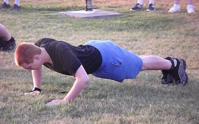 Cadet Tech. Sgt. Don Coletta, 16, from Sheridan, Wyo., does push-ups during physical training in the morning of Aug. 4, 2012, during the Wyoming Wing, Civil Air Patrol Encampment, at Camp Guernsey Joint Training Center, Wyo. The encampment is an opportunity for new CAP cadets to learn skills, while more experienced cadets serve as the encampment’s staff, under the supervision of adult CAP members. (Civil Air Patrol photo by Cadet Senior Master Sgt. Samantha Stanfill)