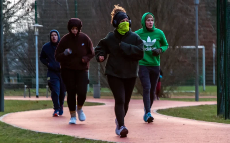 Kaiserslautern Military Community members run on the outdoor track on Ramstein Air Base, Jan. 8, 2024. KMC members participated in a running improvement program designed for runners of various skill levels by including walk to run, beginner, intermediate and advanced groups. (U.S. Air Force photo by Airman 1st Class Eve Daugherty)