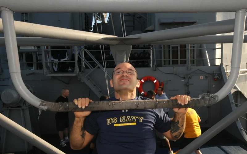 ATLANTIC OCEAN (Feb. 18, 2011) Engineman 1st Class Kevin L. Kibbe does pull-ups on the outdoor gym aboard the guided-missile cruiser USS Anzio (CG 68). Anzio is conducting a joint task force exercise as part of the George H.W. Bush Carrier Strike Group in preparation of an upcoming deployment. (U.S. Navy photo by Mass Communication Specialist 3rd Class Brian M. Brooks/Released)