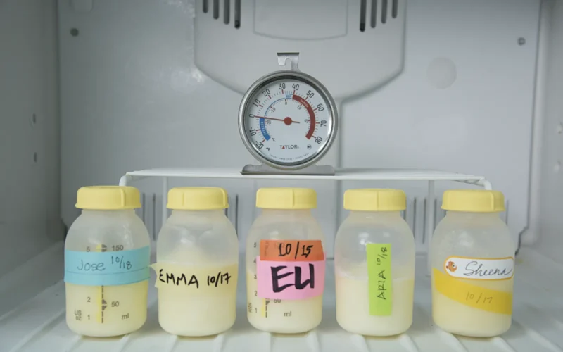 Bottles of frozen breastmilk shown in the freezer with the baby’s name and date labels clearly visible. Freezer thermometer showing appropriate temperature (0˚ F) in a child care center. Find Team Nutrition resources for child care at: www.fns.usda.gov/tn/child-care-organization. All photos are property of USDA with unlimited rights to the use and redistribution of the images.