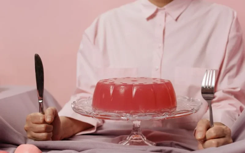 Elegant table setting with red gelatin dessert, evoking a sweet and inviting atmosphere.