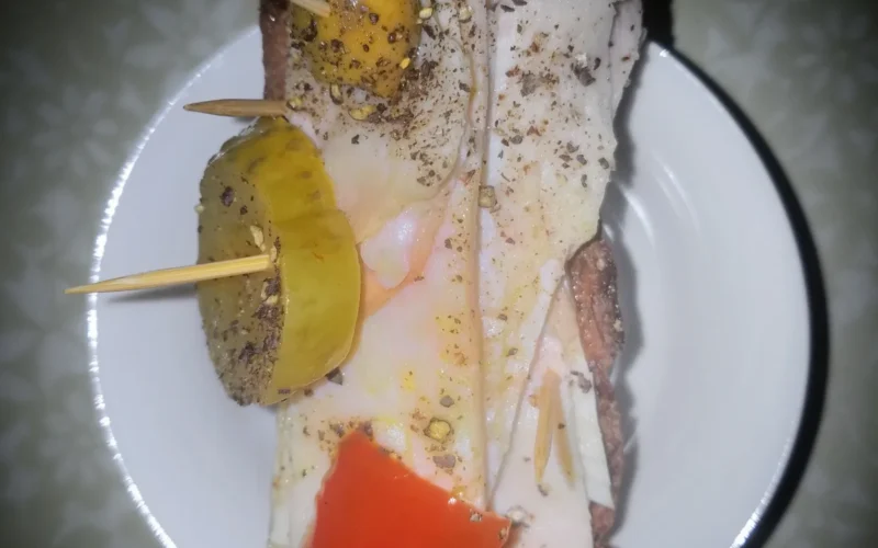 Mixed coldcut sandwich with antipasto, olive oil, and black pepper, on toasted homemade bread - Massachusetts, USA.