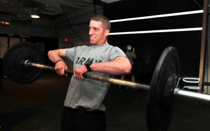 Capt. Darren Riley, assistant operations officer with 2nd Brigade Combat Team (Advise and Assist), 1st Cavalry Division, U.S. Division-North, from Salado, Texas, lifts a weight during a training routine at Joint Base Balad, Iraq, Sept. 18, 2011. U.S. Army photo by Sgt. Justin A. Naylor / Released)