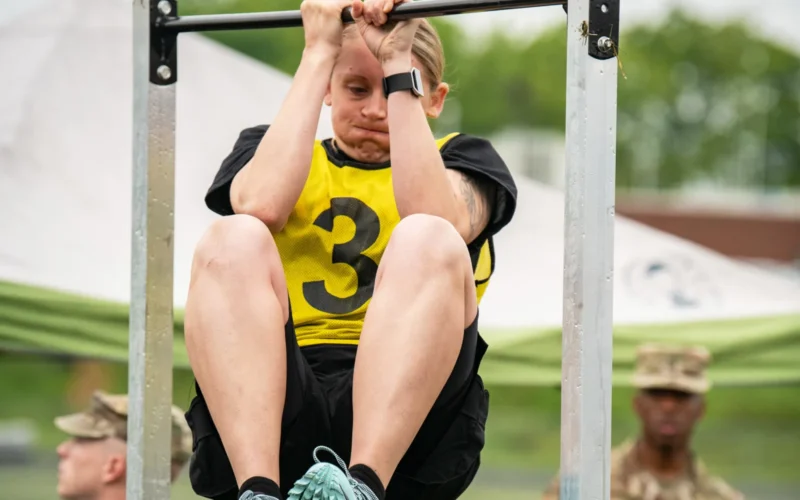 Staff Sgt. Cassandra Black, 70th Regional Training Institute, Maryland National Guard, participates in the leg-tuck portion of the Army Combat Fitness Test (AFCT) May 17, 2019, during the Region II Best Warrior Competition at Camp Dawson, West Virginia. This four-day event is designed to measure the physical abilities, leadership skills, teamwork and critical thinking of Soldiers from the West Virginia, District of Columbia, Pennsylvania, Delaware, Maryland and Virginia Army National Guards while completing basic and advanced warrior tasks to crown the region’s best warrior. (U.S. Army National Guard photo by Bo Wriston)