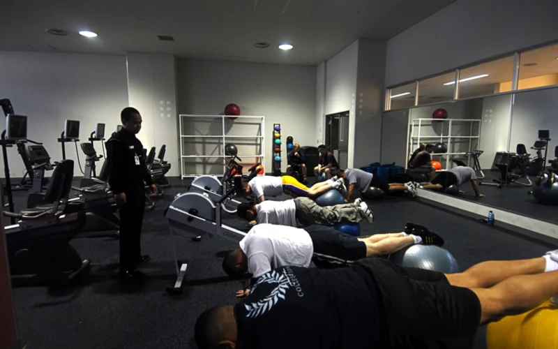 SASEBO, Japan (May 3, 2007) – Hospital Corpsman 2nd Class John Abasta, from Naval Branch Health Clinic Sasebo Japan, assists his patients during lumbar physical therapy at the Fleet Fitness Center in Sasebo. Abasta uses this technique to strengthen the muscles in the back to help alleviate back pain. U.S. Navy photo by Mass Communication Specialist 3rd Class David Didier (RELEASED)