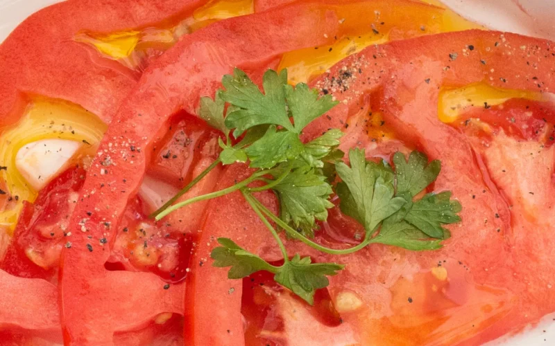Spanish Tomato Salad Yields 4 servings Prep Time: 5 minutes | Cook Time: 0 minutes | Total Time: 5 minutes 2 tomatoes 2 cloves of garlic 1 tbsp parsley 3 tbsp olive oil salt and pepper, to taste 1. Wash, slice, and then cut tomatoes in half. 2. Peel and finely chop cloves of garlic. 3. Wash and chop fresh parsley. 4. Place tomatoes on a plate and dress with salt, pepper, olive oil, garlic, and parsley. Serve cold and enjoy! Today, at the VegU tent, people learn how to how to pick, store, and prepare a Spanish Tomato Salad using tomatoes, parsley and olive oil from vendors at the U.S. Department of Agriculture (USDA) Farmers Market, where USDA employees from the Agricultural Marketing Service (AMS), Food and Nutrition Service (FNS), and Food Safety and Inspection Service (FSIS) volunteer as ‘VegUcators’ conducting free 10-minute fruit and vegetable classes in Washington, D.C., on Friday July 22, 2016. During this season of the outdoor USDA Farmers Market, 26 recipes will be taught at the VegU tent. Their scheduled demonstration dates are the peak harvest time to look for these foods. The goal is to increase fruits and vegetables in meals and help people understand what is in season. Guests can receive a free recipe card, and can start shopping for ingredients at the market. www.usda.gov www.usda.gov/farmersmarket peoplesgarden.usda.gov @USDA_AMS USDAFarmersMkt USDA Media by Lance Cheung.