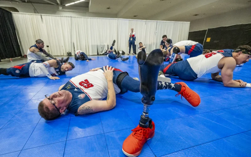 Brett Seiling, a U.S. Air Force veteran and competitor for Team U.S., stretches before a sitting volleyball match against Lithuania during the 2025 Invictus Games in Vancouver, Canada, Feb. 15, 2025. Fifty competitors make up Team U.S., which is competing along with 22 other nations in the 2025 Invictus Games. Throughout the competition, events will take place in Vancouver and Whistler, Canada, from Feb. 8-16, 2025. The competition includes 11 different events, including six adaptive winter sports, the first year that winter-specific sports have been part of the Invictus Games competition. The Invictus Games is an international sporting event for wounded, injured, and ill active duty and veteran military personnel. The Games use the power of sport to support recovery, rehabilitation and generate a wider understanding and respect for those who serve their country. The Invictus Games, like the DoD Warrior Games, are designed to enhance recovery by engaging wounded, ill, and injured service members outside of traditional therapy settings. (U.S. Army photo by Michel Sauret)