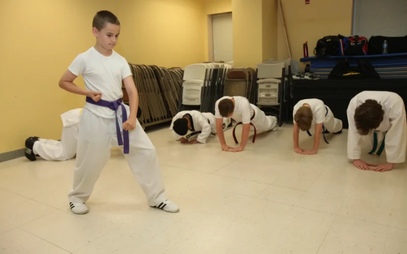 The tae kwon do class engages in boot-camp style corrective methods during practice at the Havelock Recreation Center May 13. For every mistake in the routine that Brandon A. Monk makes, the rest of the class has to do five pushups.