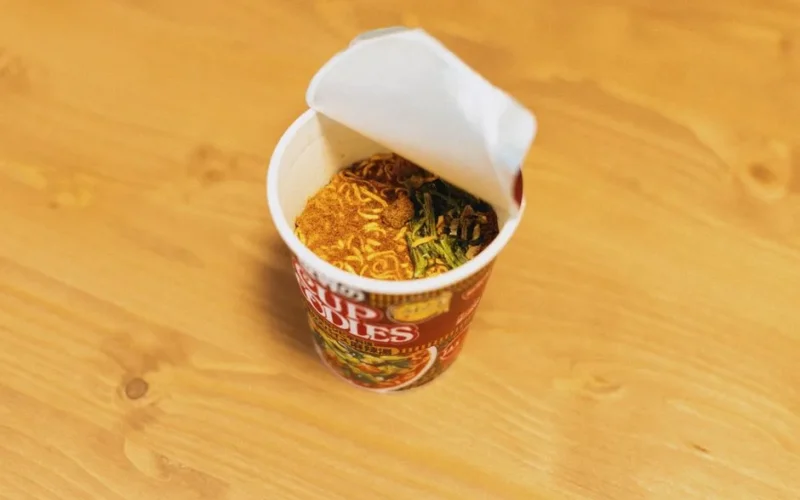 Delicious cup of instant noodles ready to prepare, showcasing Japanese fast food culture.